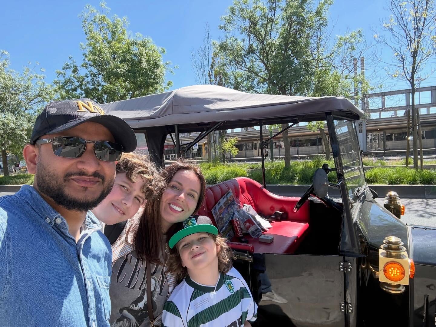 Happy customers with tour guide on a tuk tuk tour in Lisbon