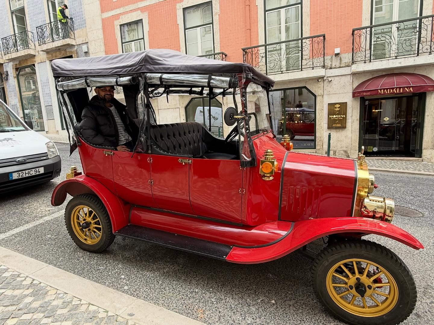 Happy customers with tour guide on a tuk tuk tour in Lisbon
