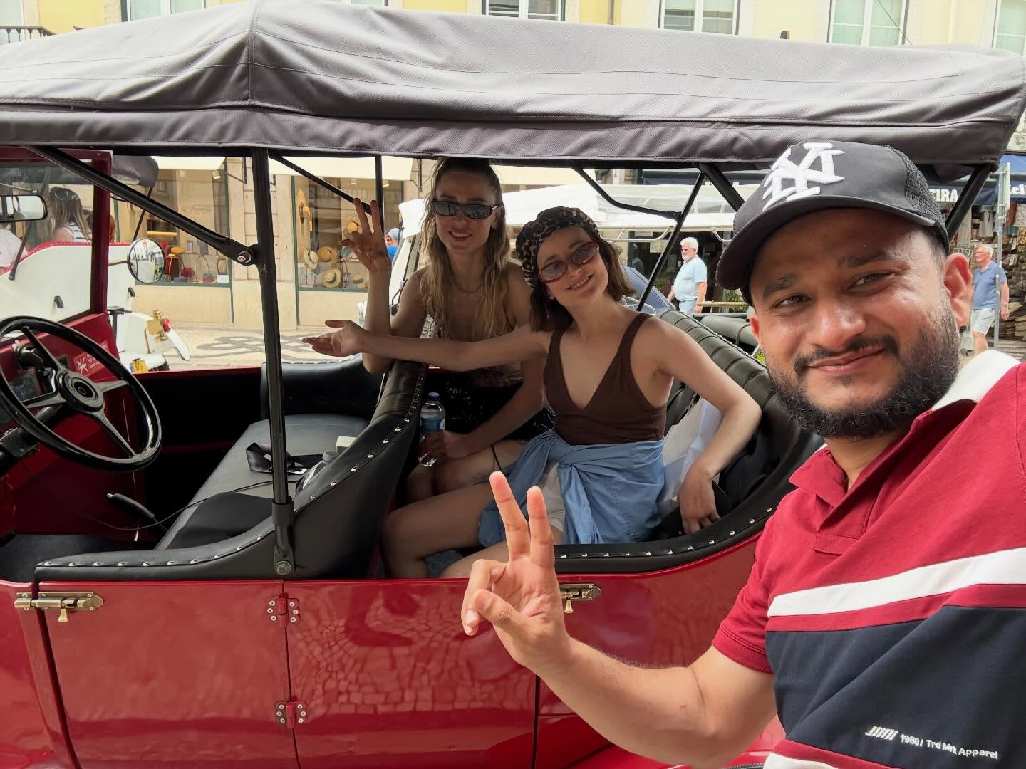 Happy customers with tour guide on a tuk tuk tour in Lisbon